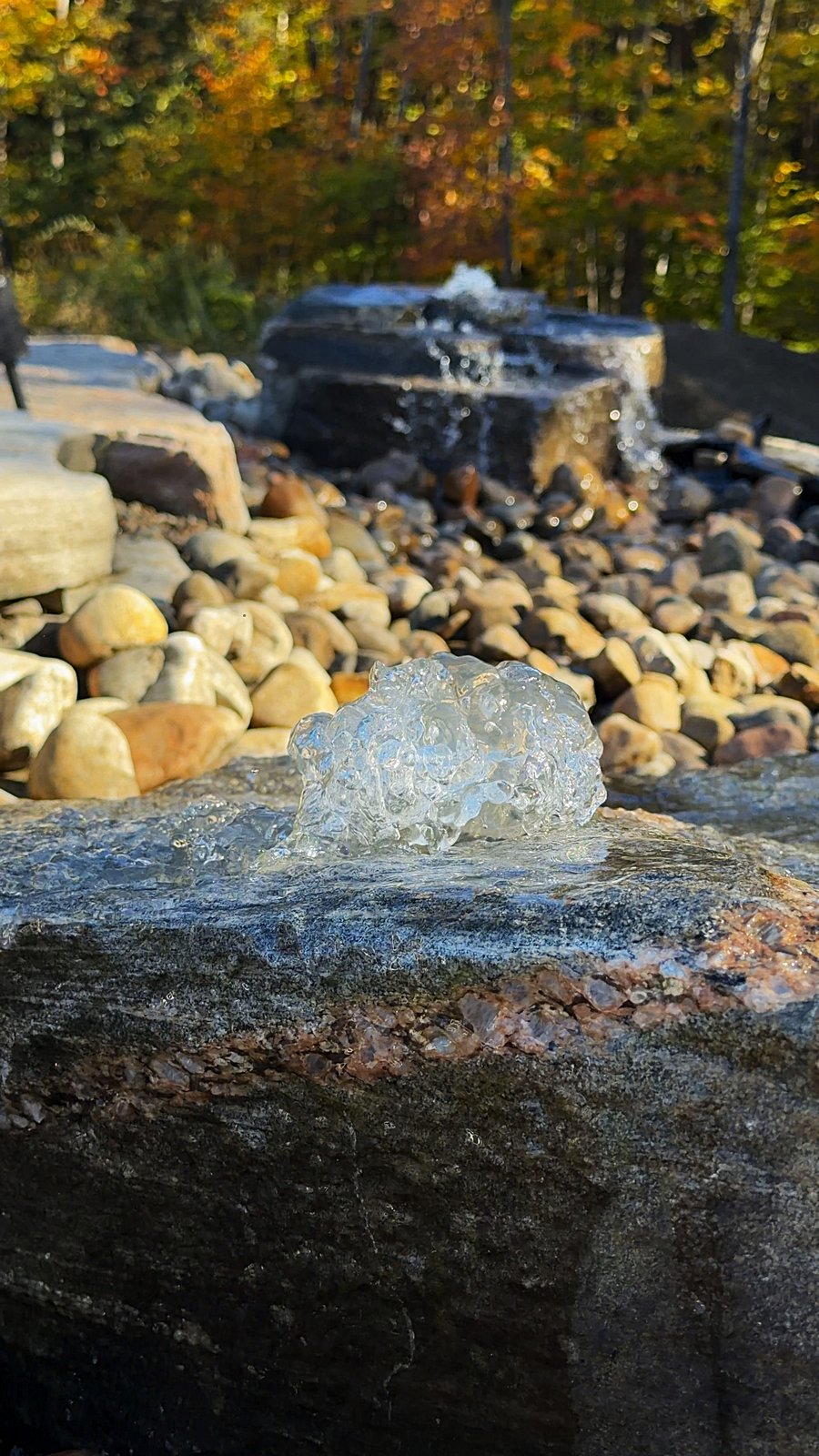 Close-up of water bubbling over granite